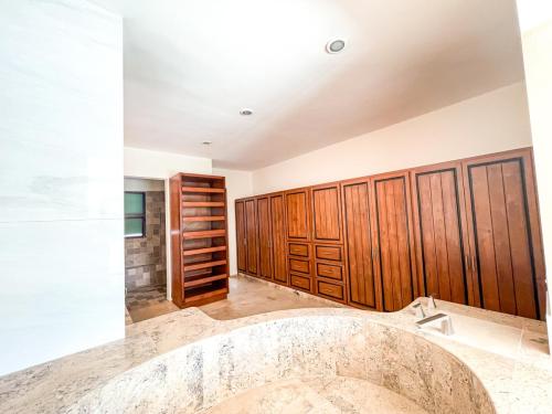 Master bedroom closet over roman tub
