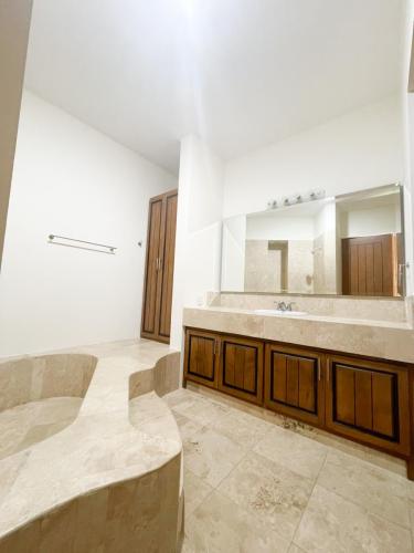 Spacious lower bathroom with roman tub
